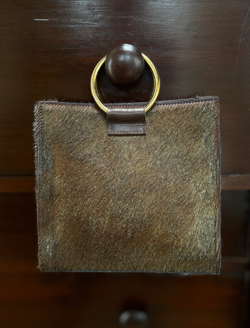 Simone sculptural handbag in brown hair-on hide with gold ring handles