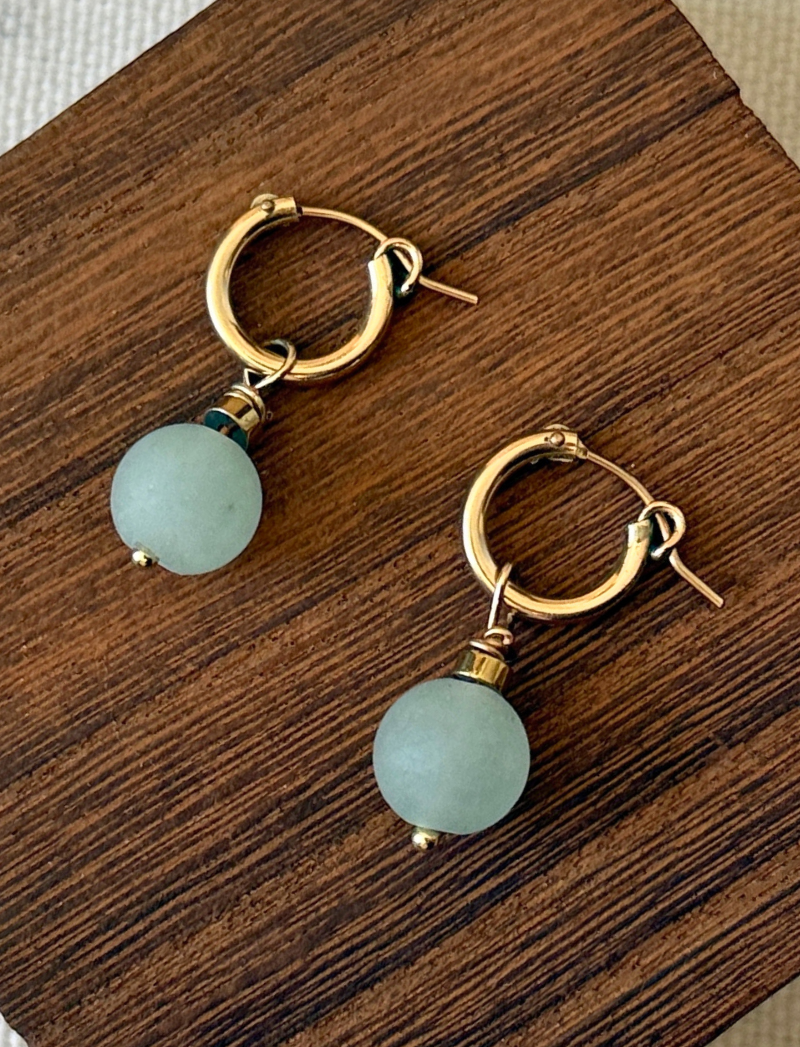 Gold-filled huggie hoops with matte seafoam bead charms