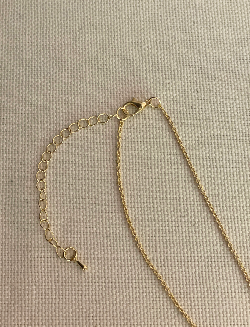 Gold chain necklace with jasper charms and snake pendant, detail view