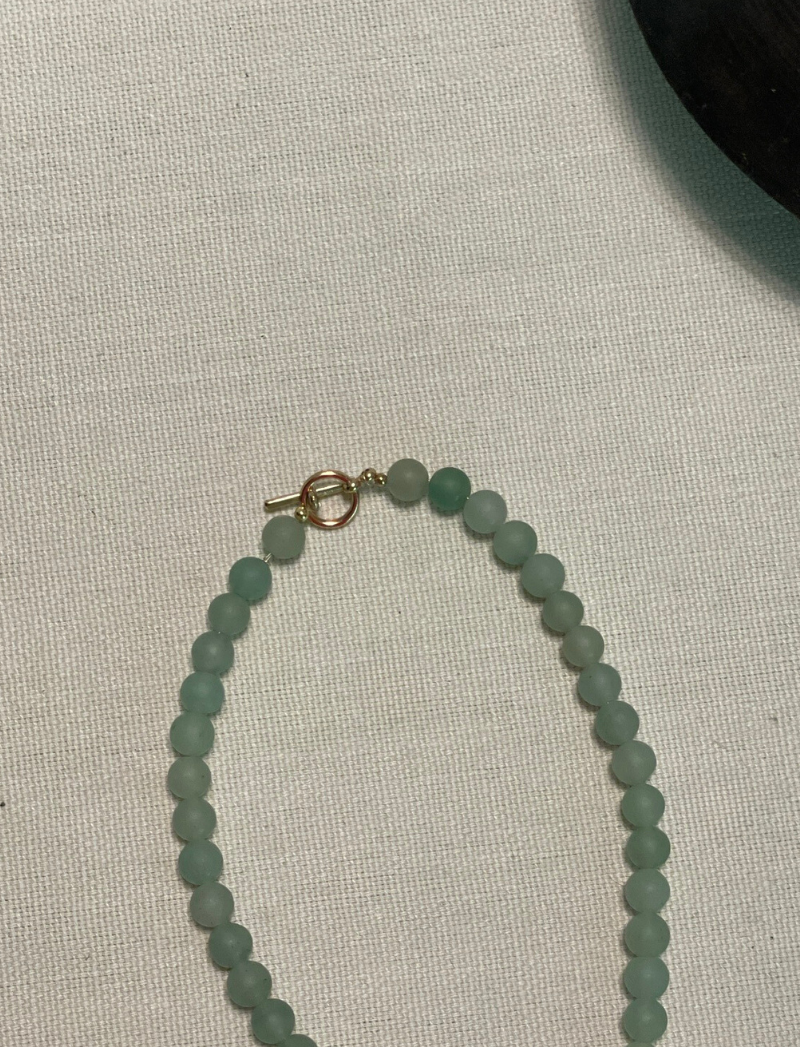 Matte seafoam glass bead necklace with green ceramic pendant, alternate view