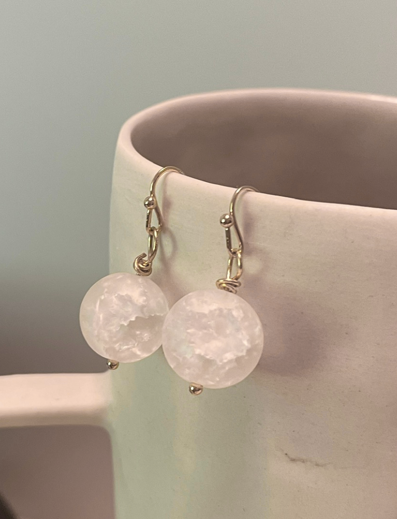 White crackled quartz earrings with gold-plated hooks, detail view