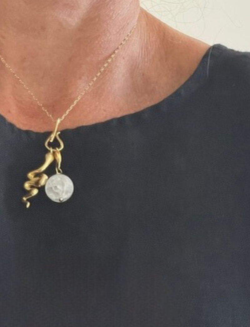 Gold chain necklace with selenite crystal and brass snake charms, alternate view