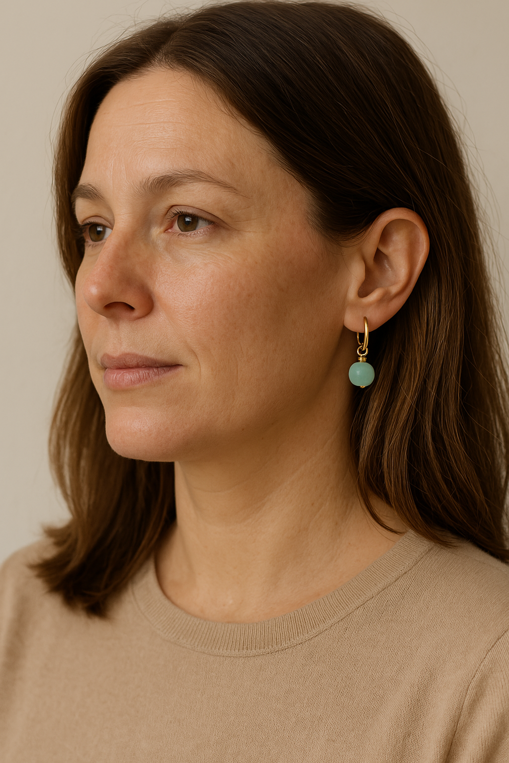 Gold-filled huggie hoops with matte seafoam bead charms, alternate view