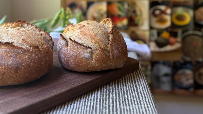 Sourdough loaves on a walnut board